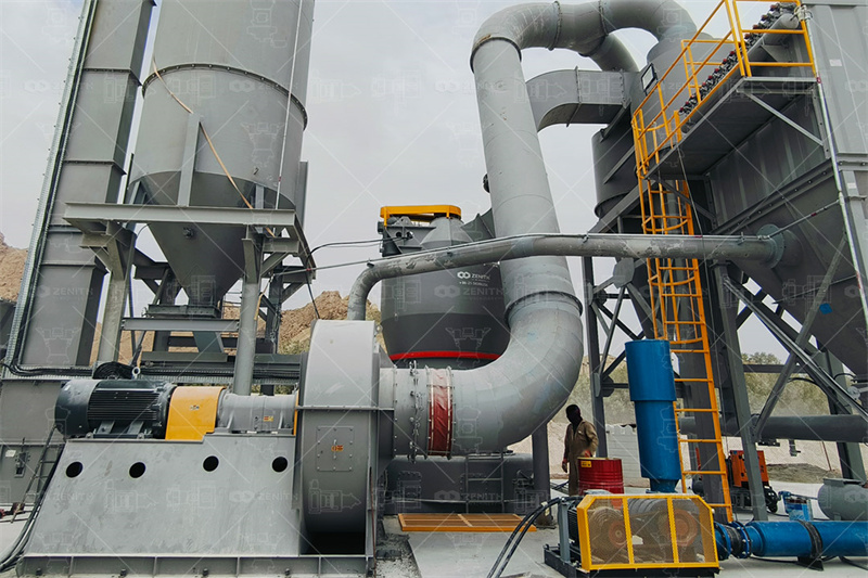 Technician performing maintenance on grinding mill components