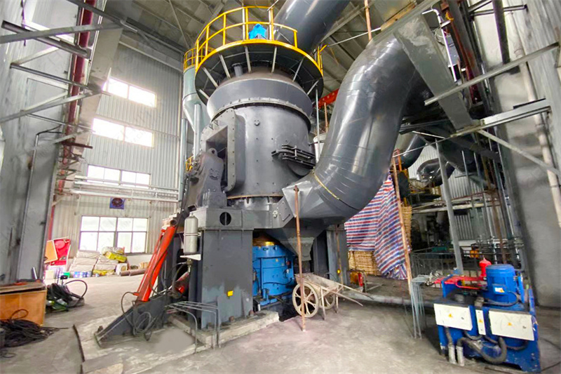Technician performing particle size analysis on mill output