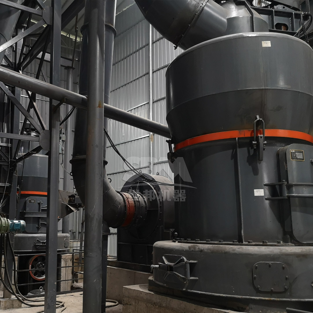 Technicians performing precision alignment on coal pulverizer components