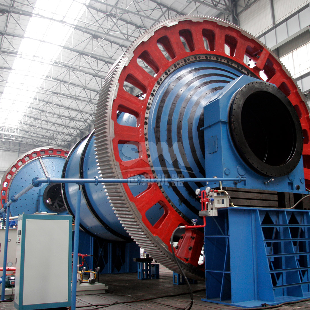 Large ball mill installation for fluorite powder production with operator for scale reference
