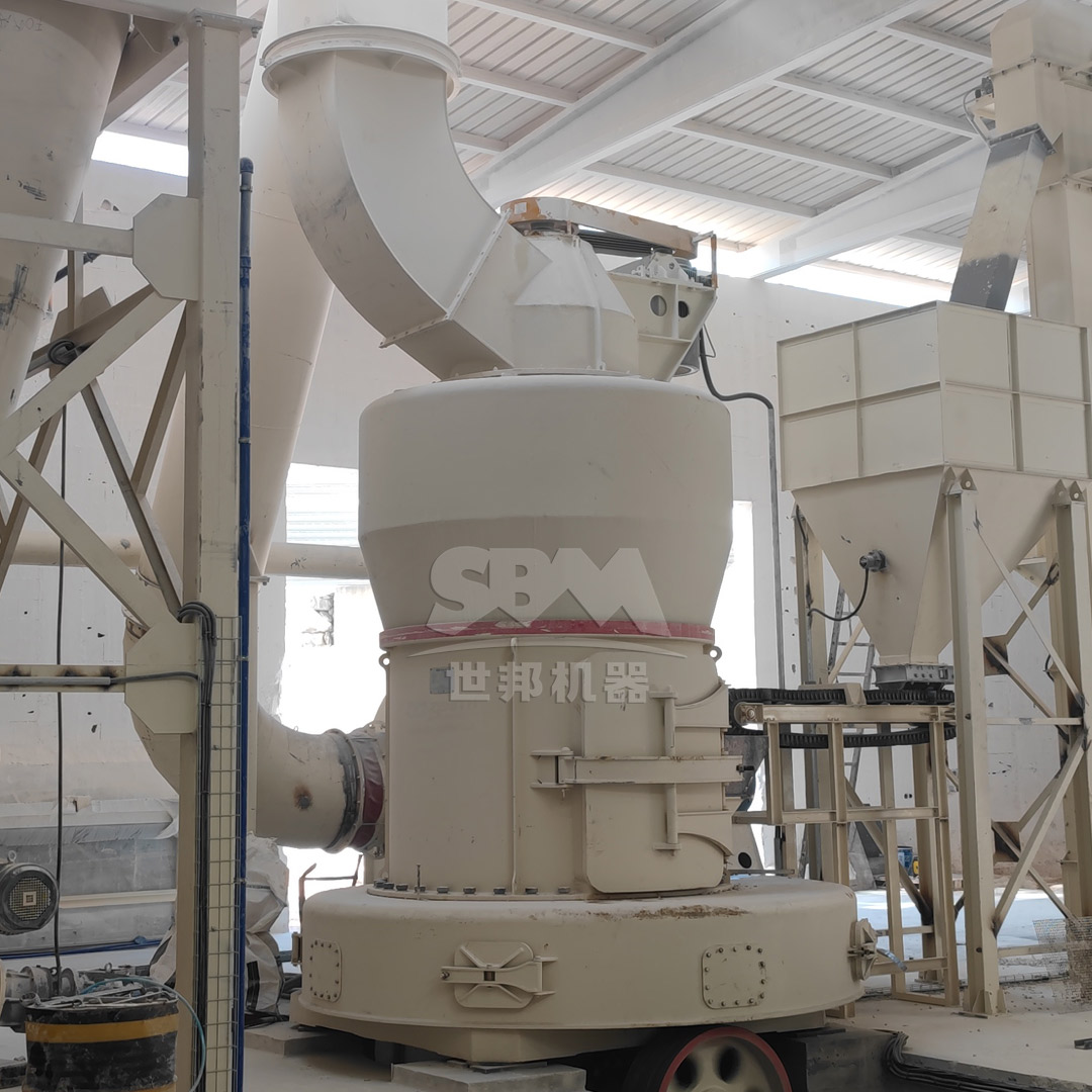 Technician performing maintenance on attapulgite grinding mill components