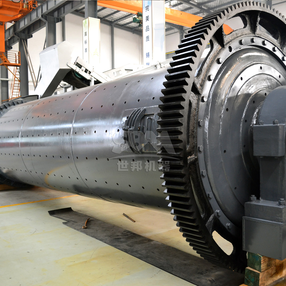 Industrial ball mill in mineral processing plant showing large rotating cylinder