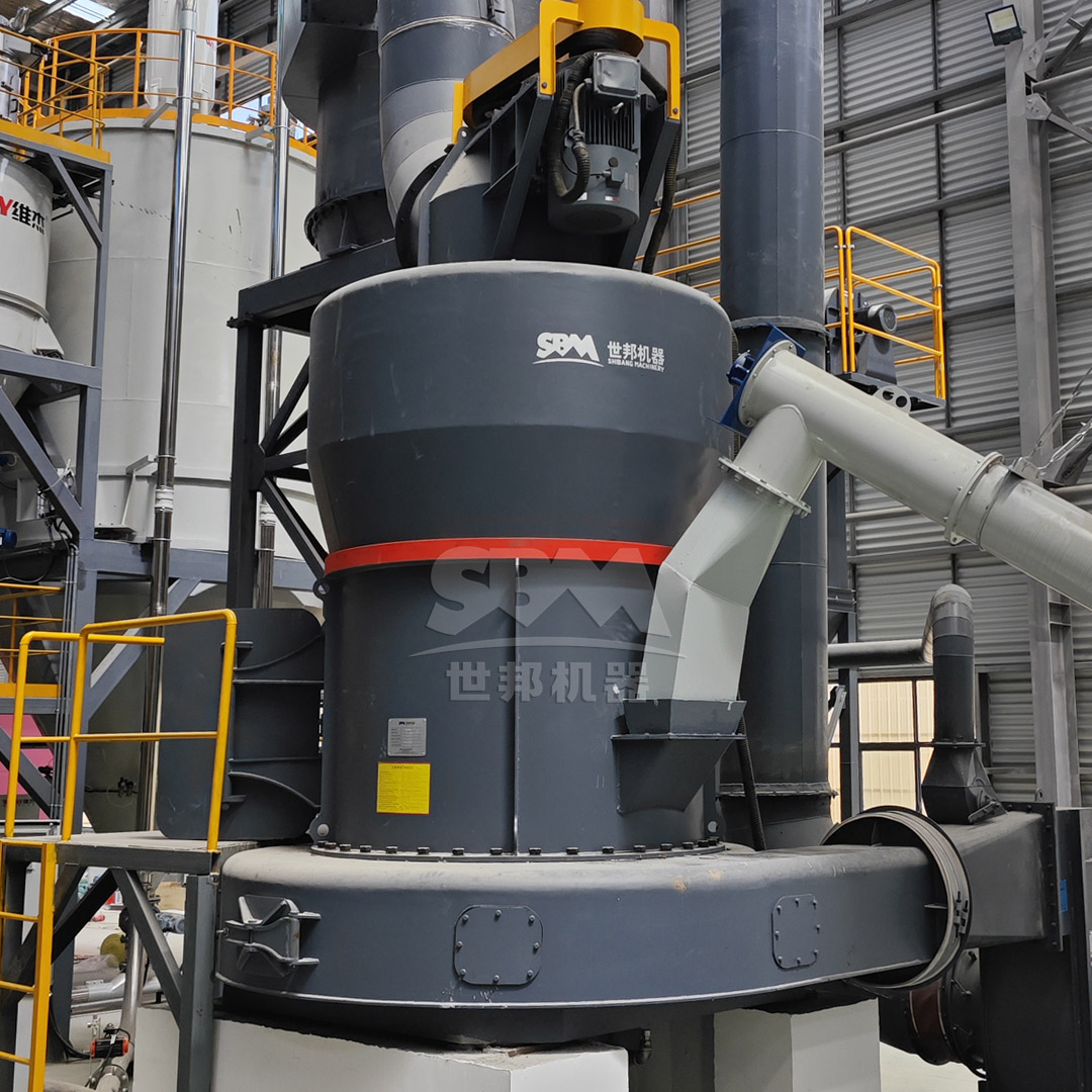 Industrial grinding plant interior showing a large MTW series mill in operation for processing attapulgite.