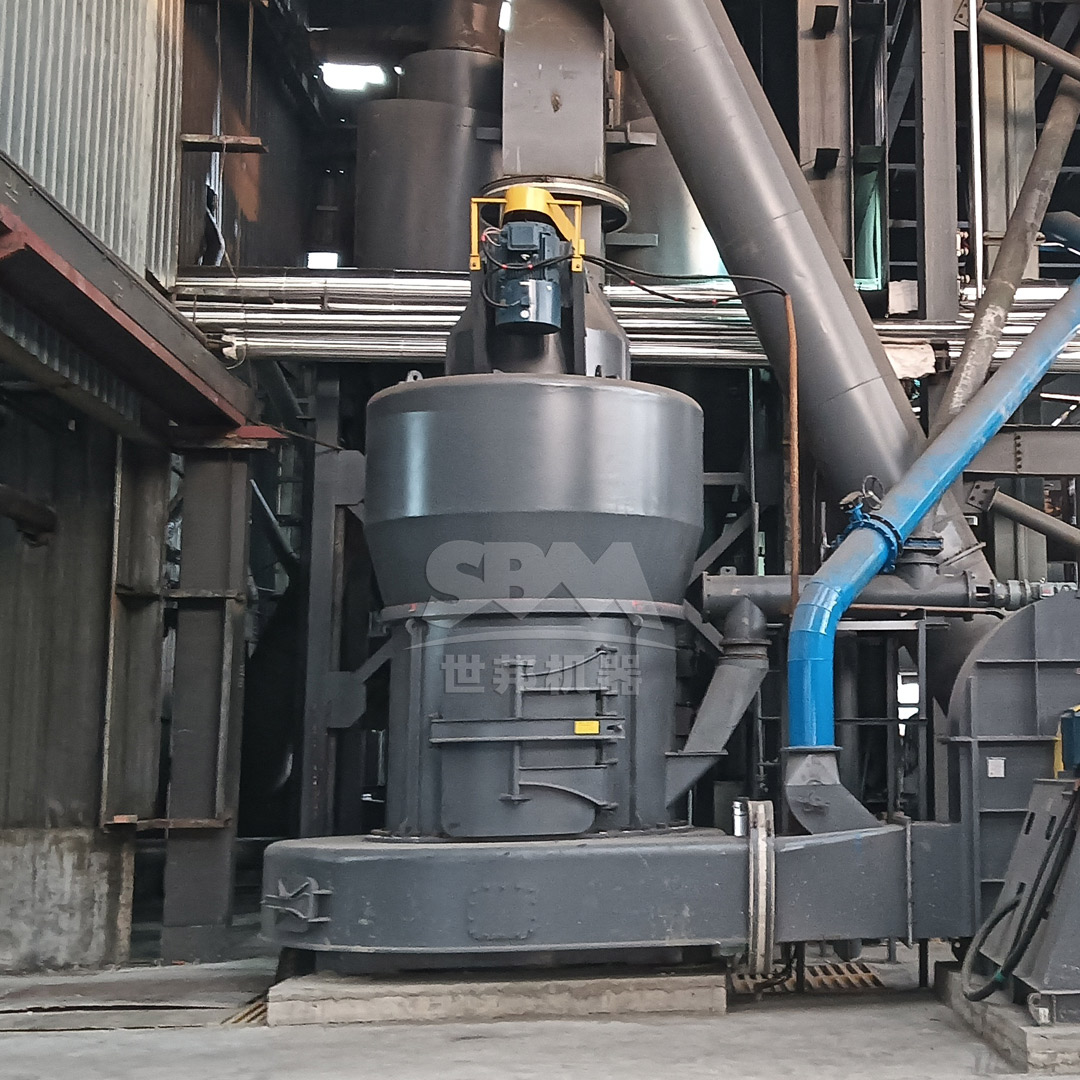 A large pile of finely ground, high-grade iron ore concentrate produced by a dry grinding system.