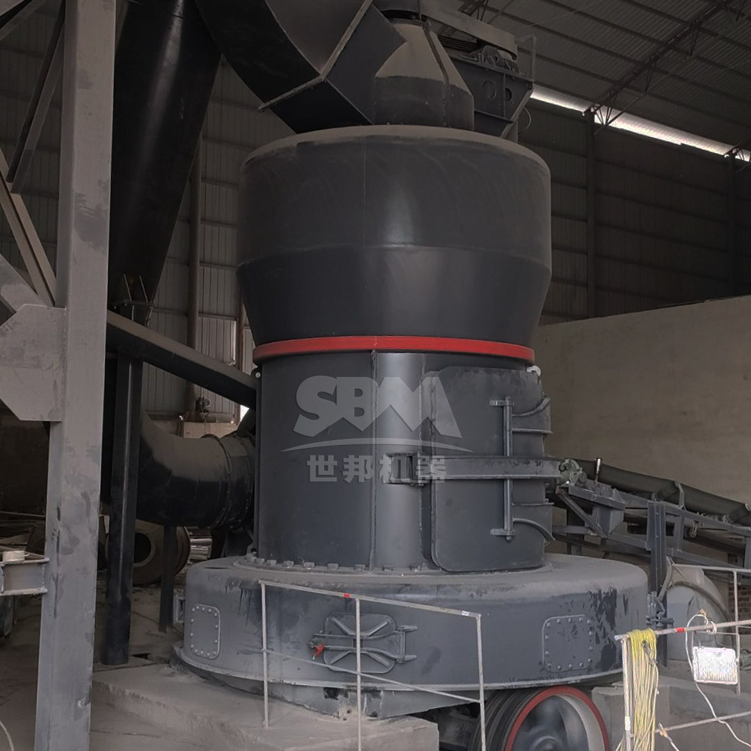 A modern gypsum crushing station featuring a vibrating feeder, jaw crusher, and hammer mill arranged on a steel structure.
