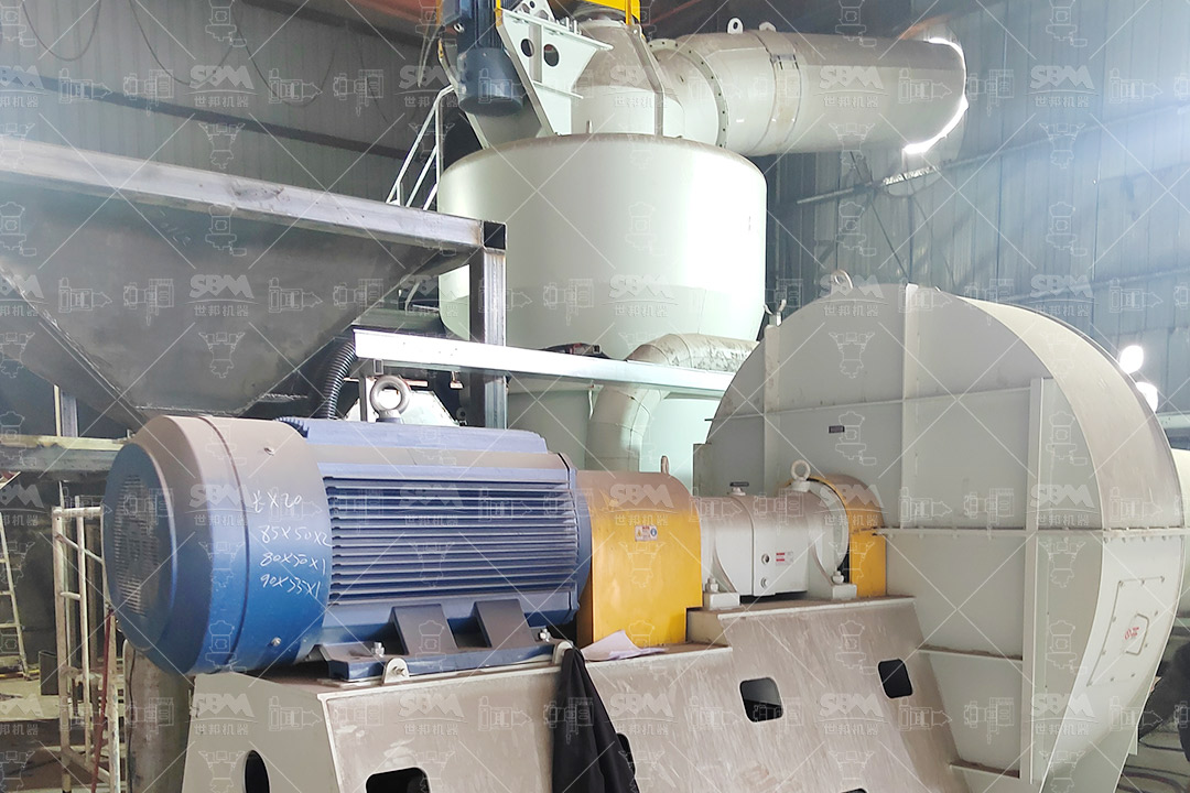 Operational view of an MTW Series mill in a mineral processing plant, with a focus on the classifier and product collection system.