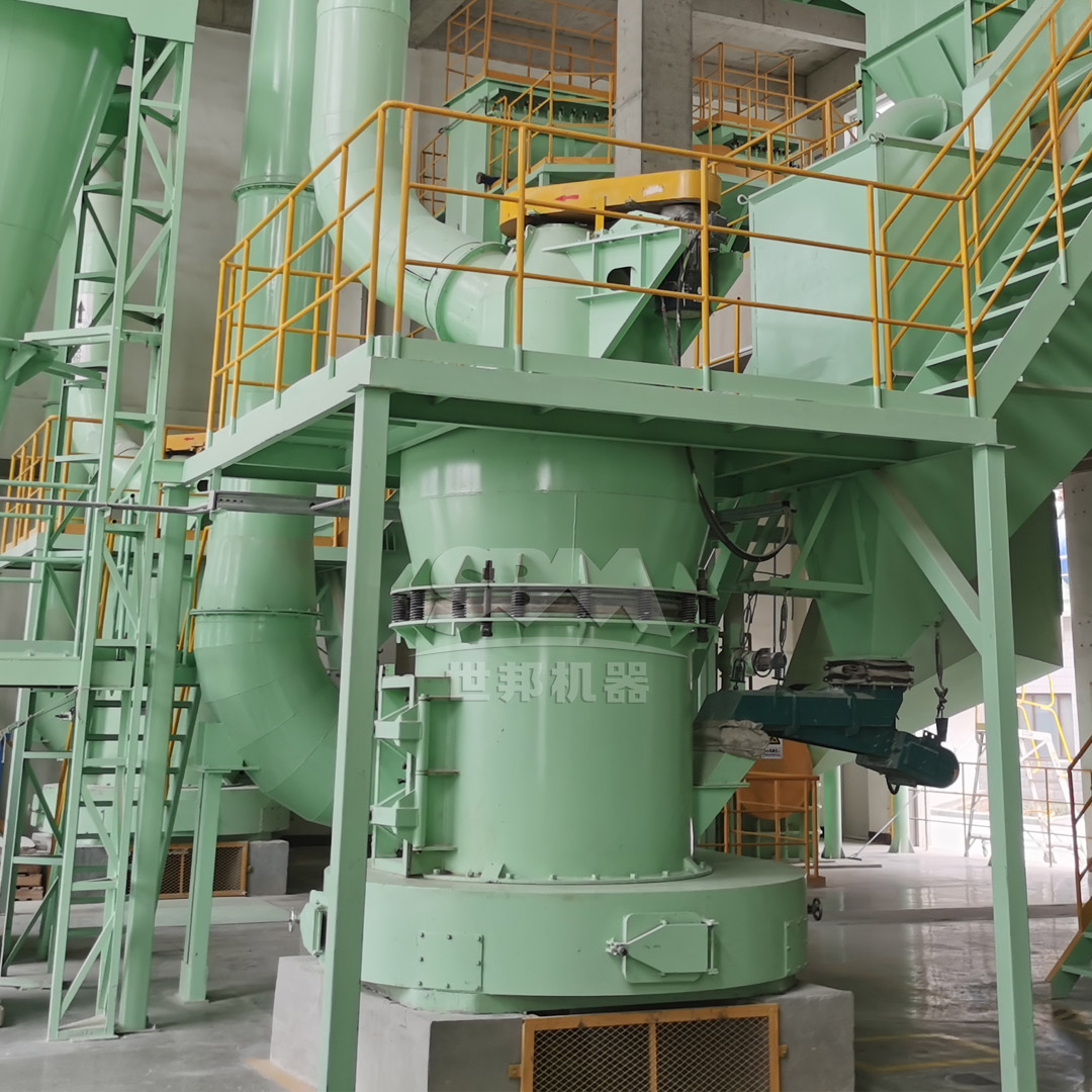 Primary jaw crusher processing large granite waste blocks into smaller fragments.