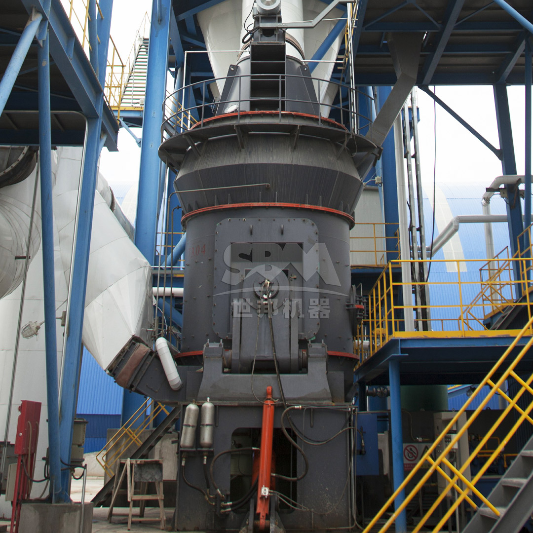 A large industrial slag grinding mill in a processing plant, showing the main grinding unit and auxiliary equipment.