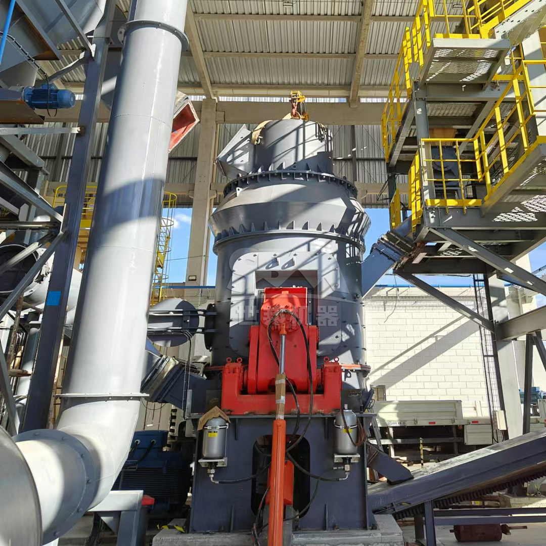 Wet flue gas desulfurization system layout showing the vertical mill area and absorber tower.
